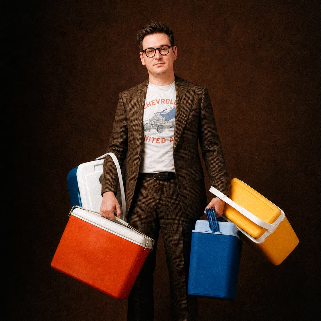 Quinn Brewer holding colorful coolers