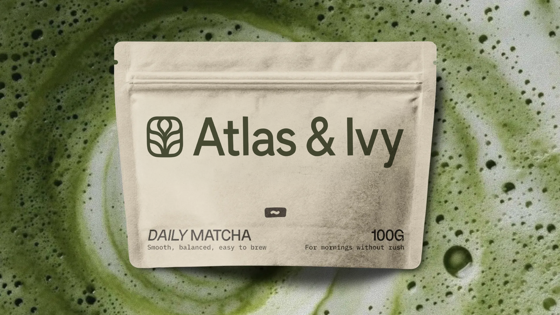 Atlas and Ivy Daily Matcha pouch photographed on whisked matcha