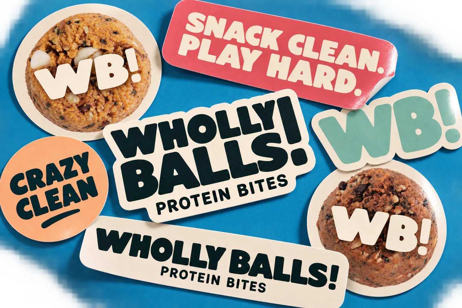 A sheet of Wholly Balls stickers: stacked and single-line wordmarks, WB! monograms over protein bites, Crazy Clean, and Snack Clean. Play Hard.